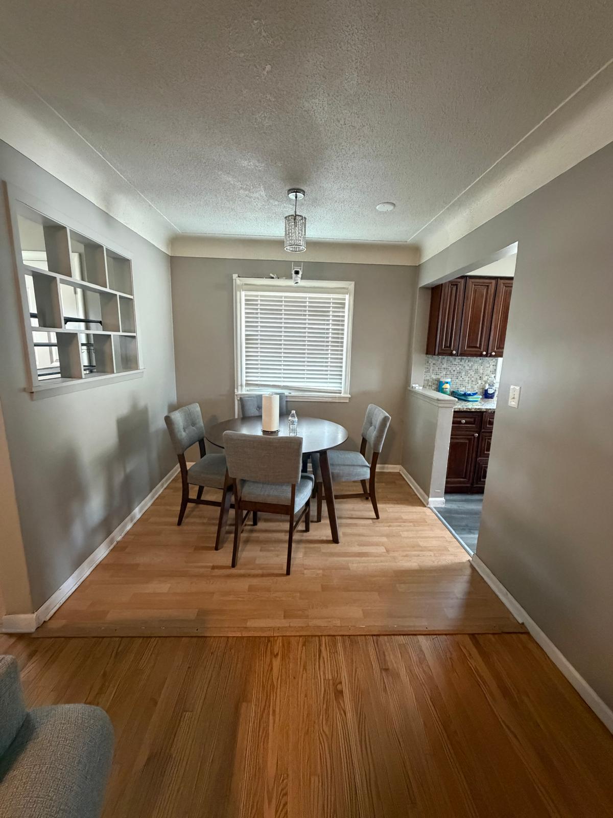 Dining area with a round table and four chairs