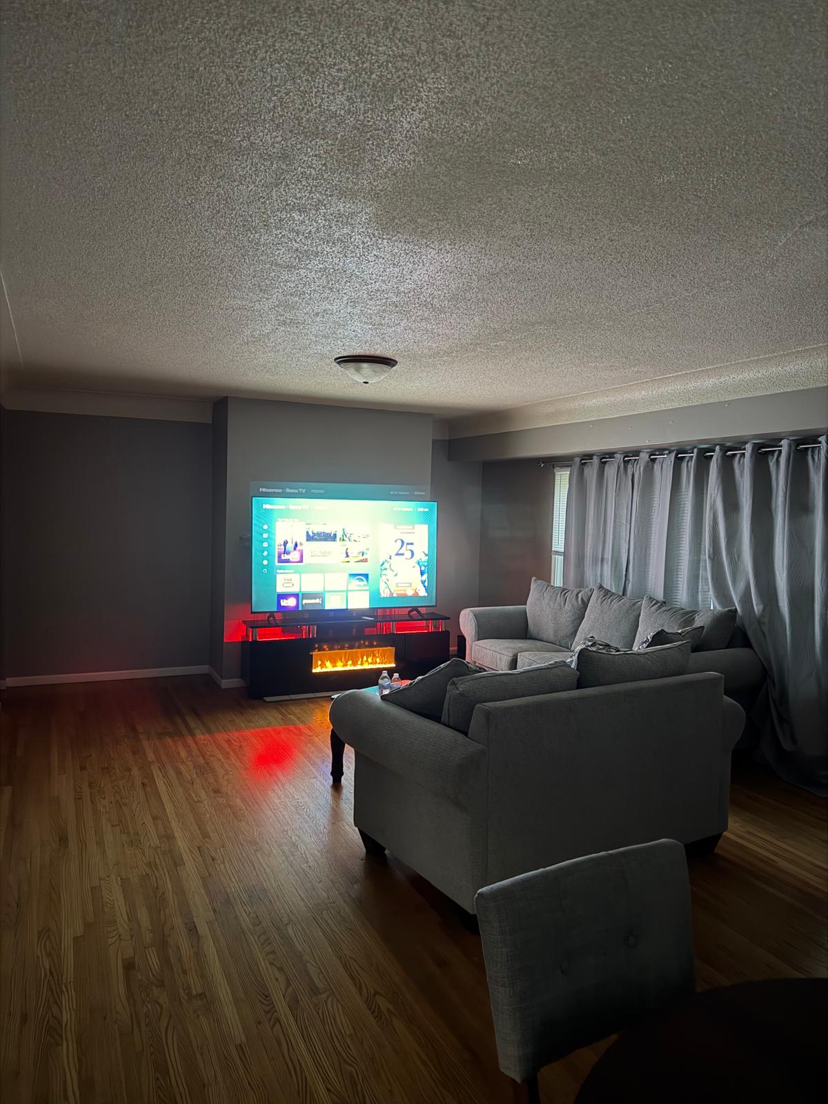 STAR HOMES living room with fireplace and television